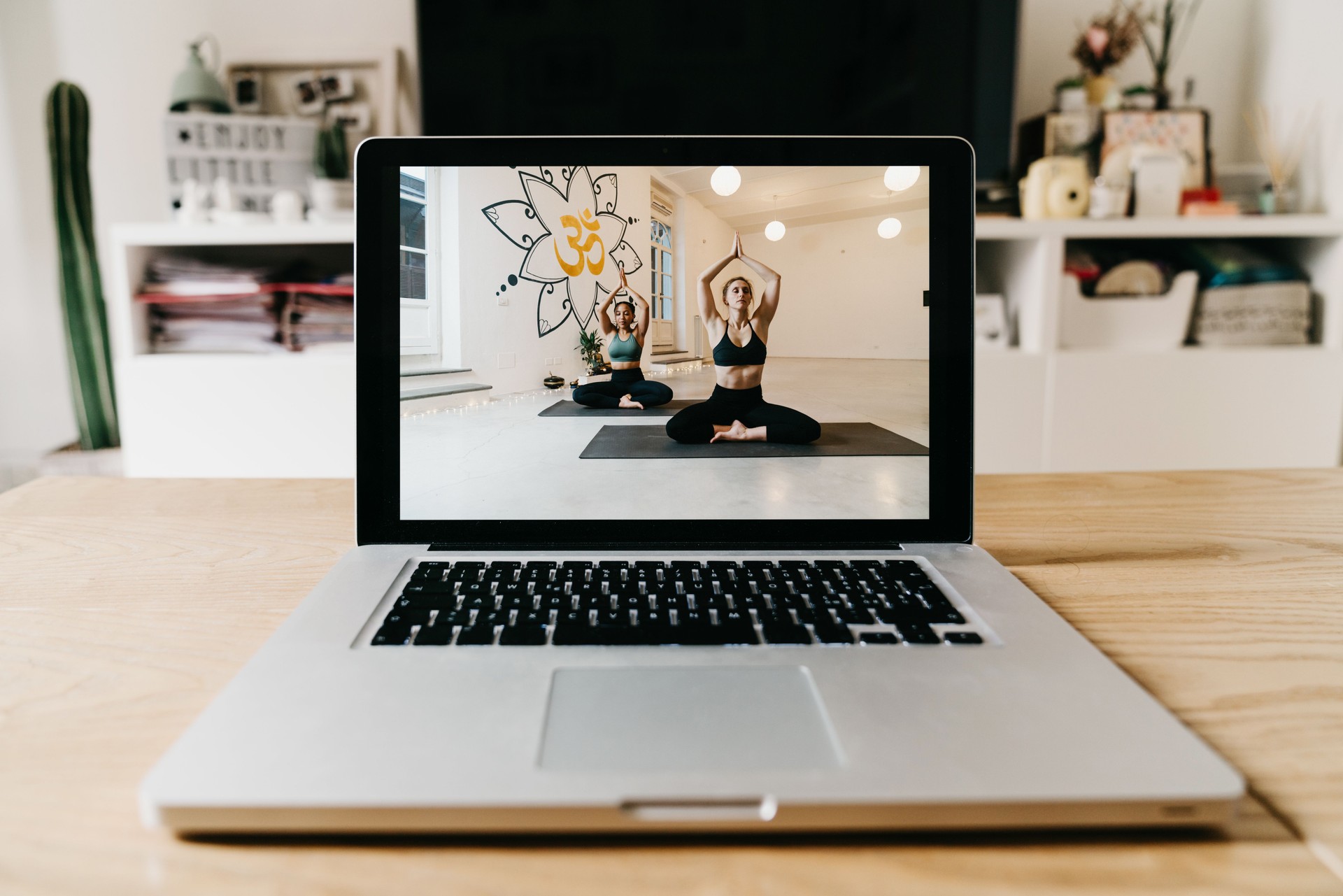 The laptop is ready for an online yoga video lesson